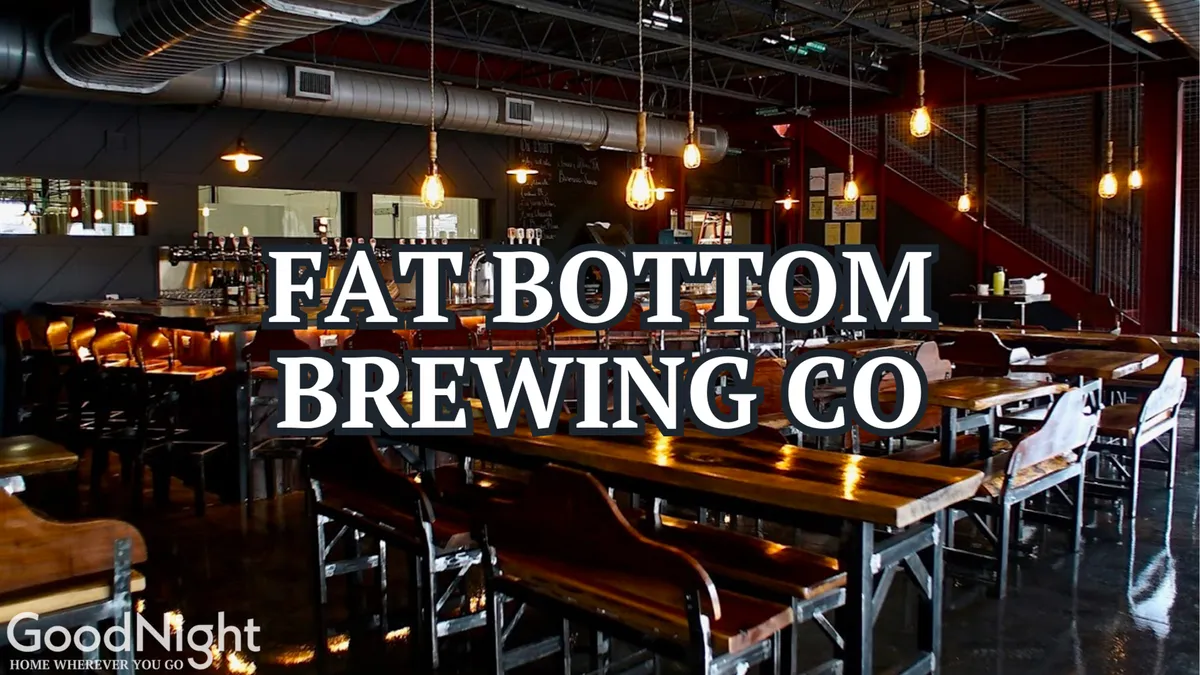 An upbeat brewery interior with long wooden tables, a bustling bar area, and visible brewery equipment in the background. Groups of friends are socializing and enjoying craft beers in a lively, casual setting.